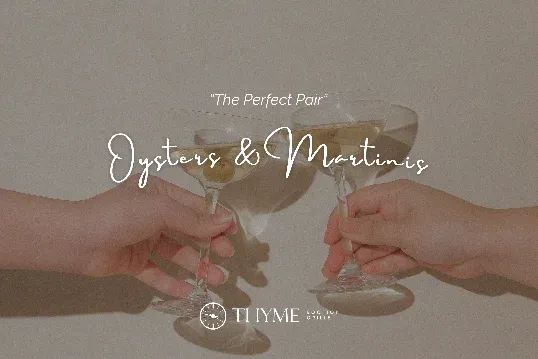 Two hands clinking martini glasses, with the words "The Perfect Pair: Oysters & Martinis" overlaid.