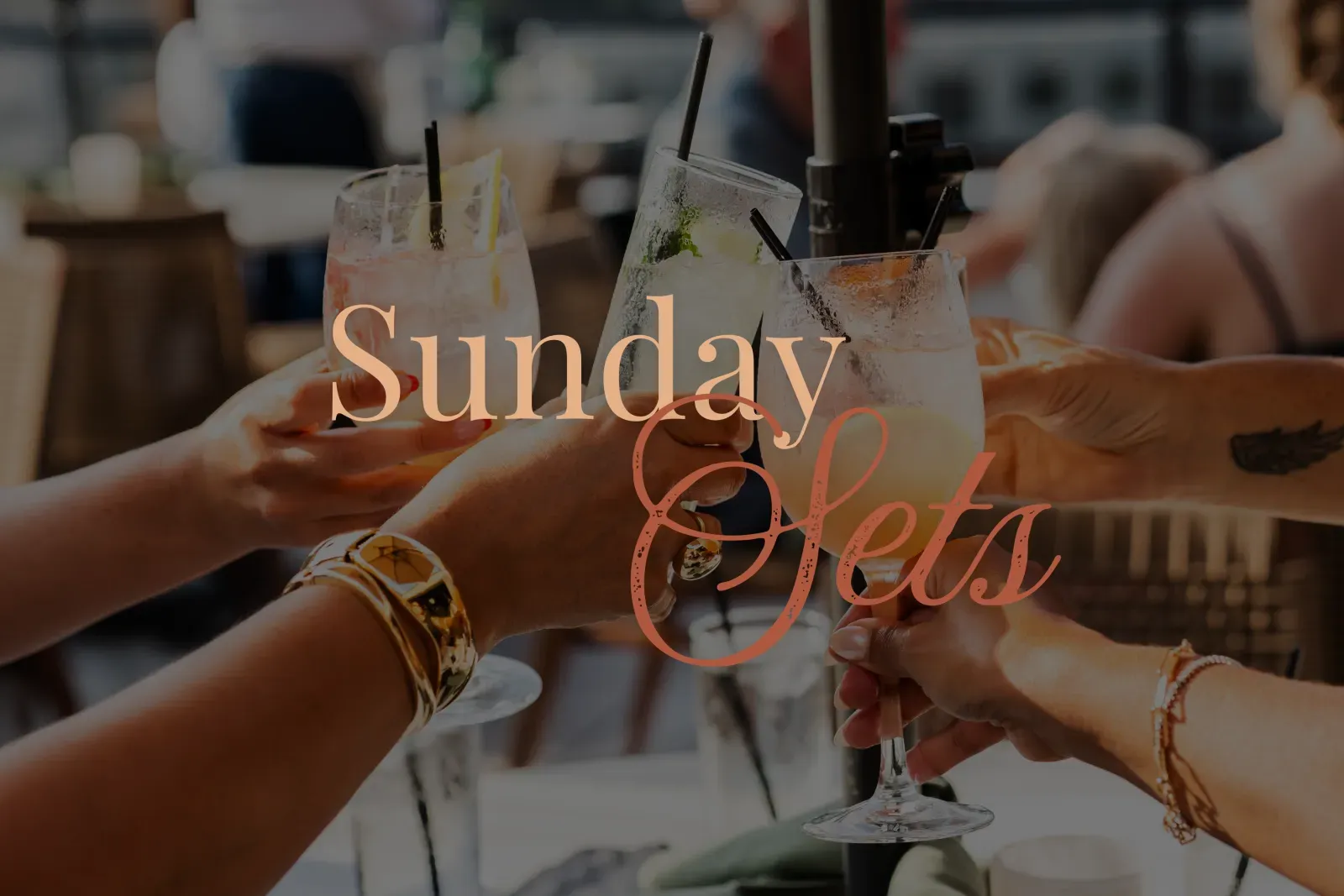Friends cheersing cocktails on the Thyme terrace with the words "Sunday Sets" overlaid.